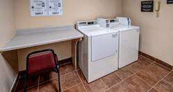 Guest Laundry Room with Table and Chair