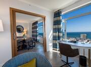 Panoramic Suite Desk and Dining Area with Sea View