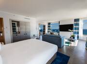 Panoramic Suite Bed and Living Area with Sea View