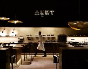 AÜRT restaurant with team member walking through