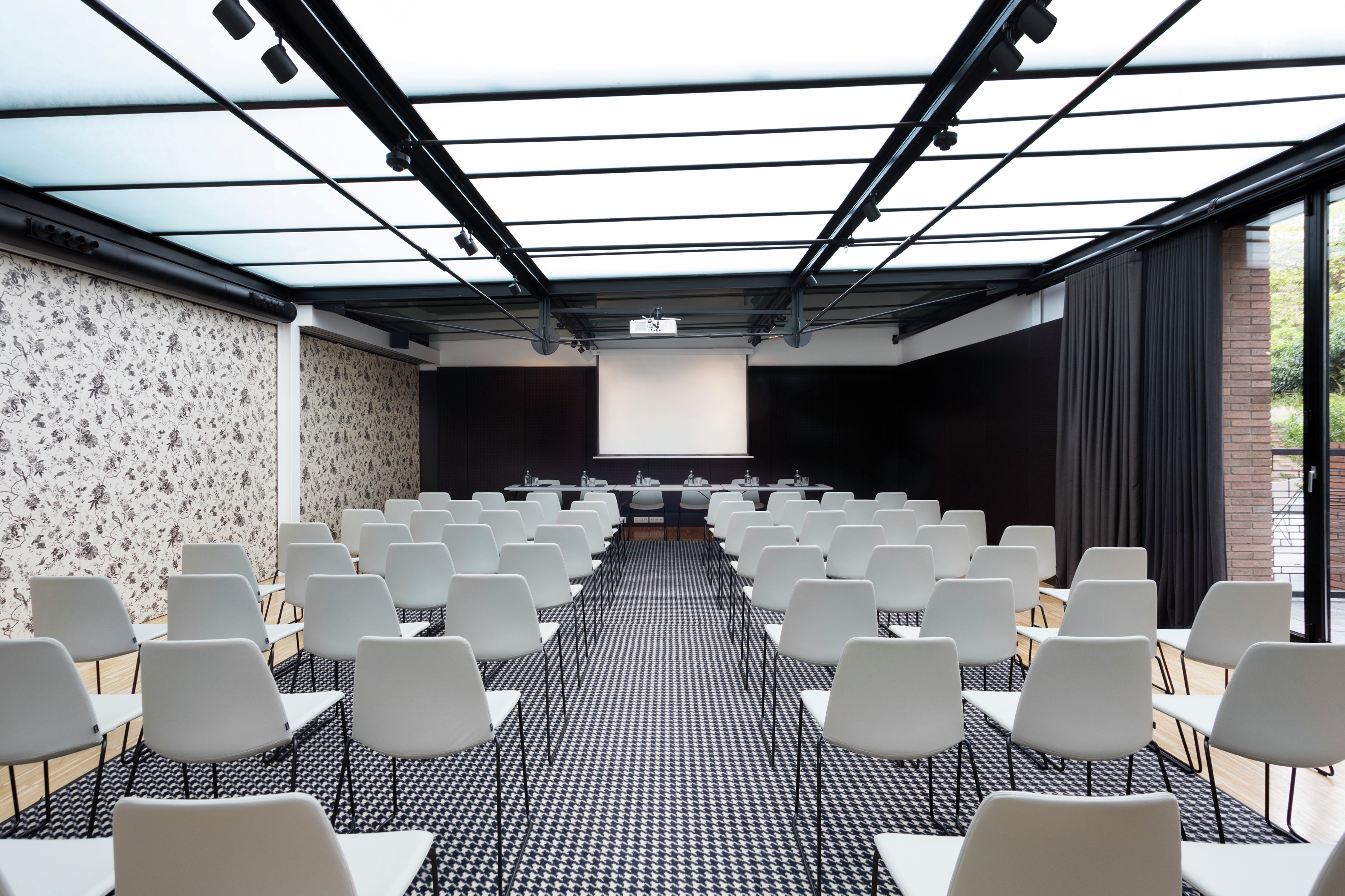 Alexandra Barcelona Curio Hotel Ballroom with Chairs and Projector Screen