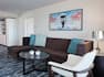 View of the Seating and Tables in the living area of a 1 King, 2 room Suite at the Waterstone Resort and Marina Boca Raton, Curio Collection by Hilton, FL - 