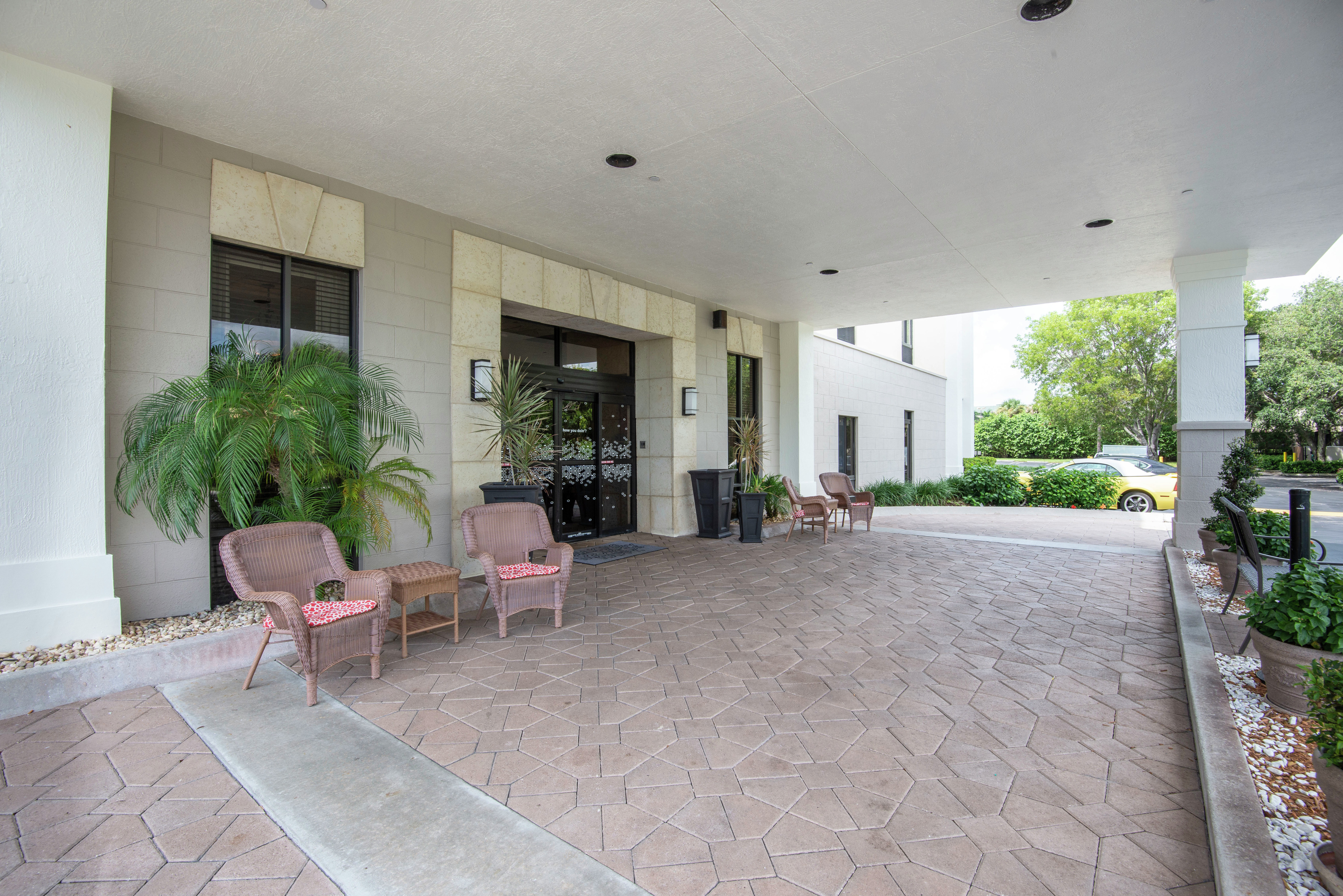 Hotel Exterior Entrance with Seating Area