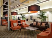 Pendant Lighting Above Armchairs, Sofas and Tables in Atrium Lounge Area