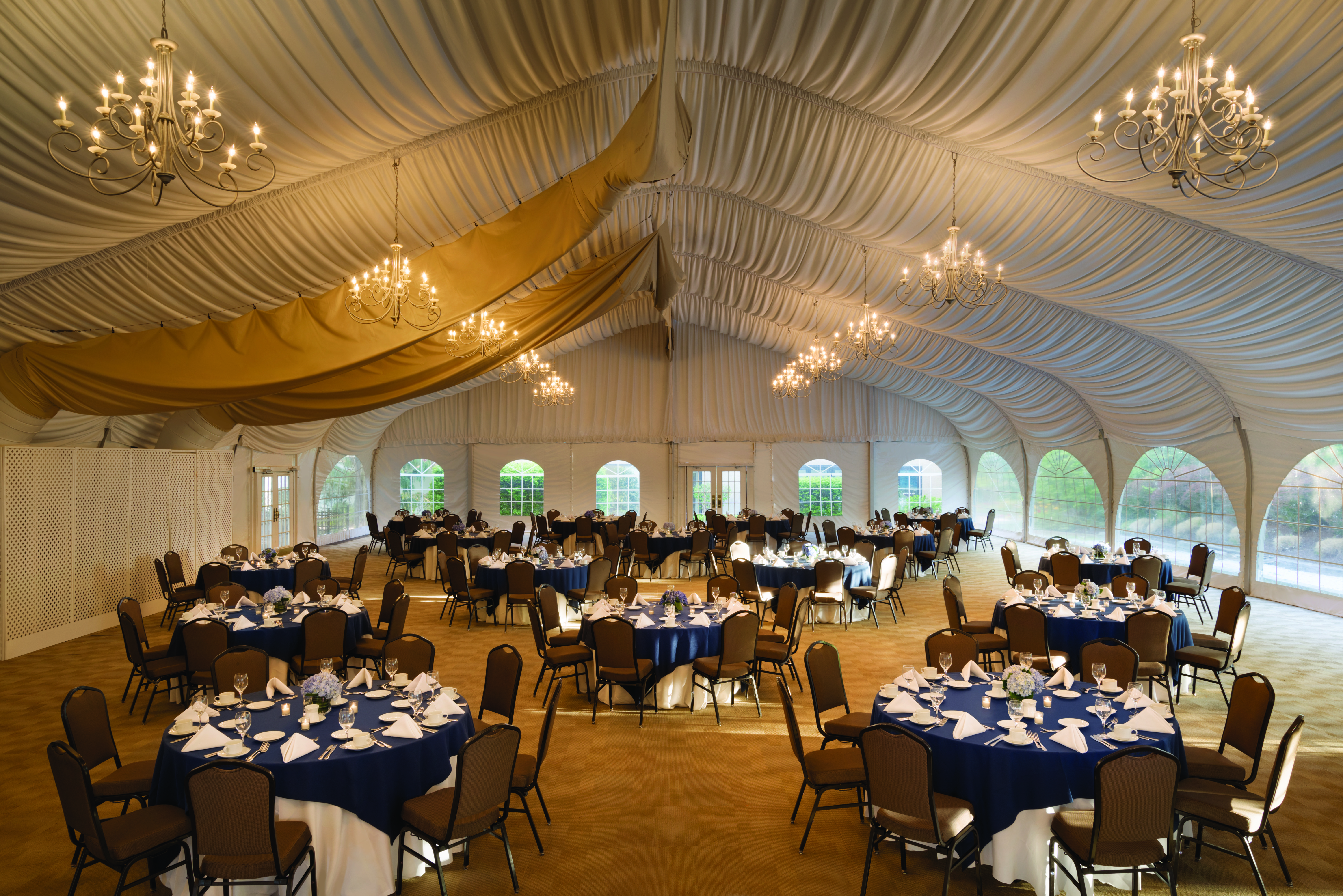 Pavilion with Round Tables and Chairs Setup for Event