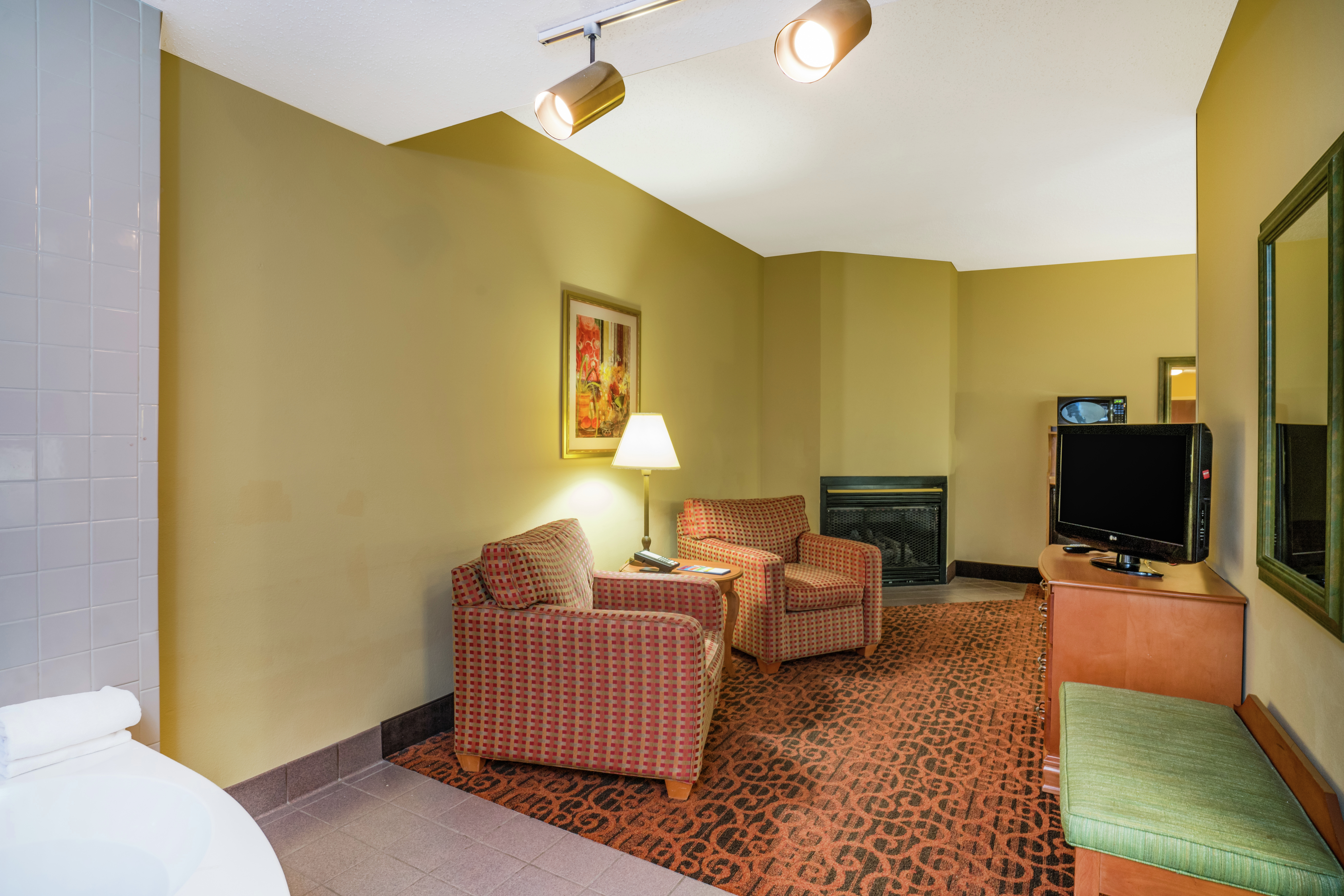 King Suite with Lounge Area, TV, and Fireplace