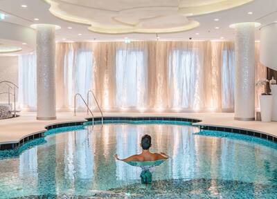 Man relaxing in a swimming pool