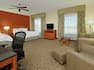 Studio Suite with Two Queen Beds, Lounge Area, Work Desk, and Room Technology