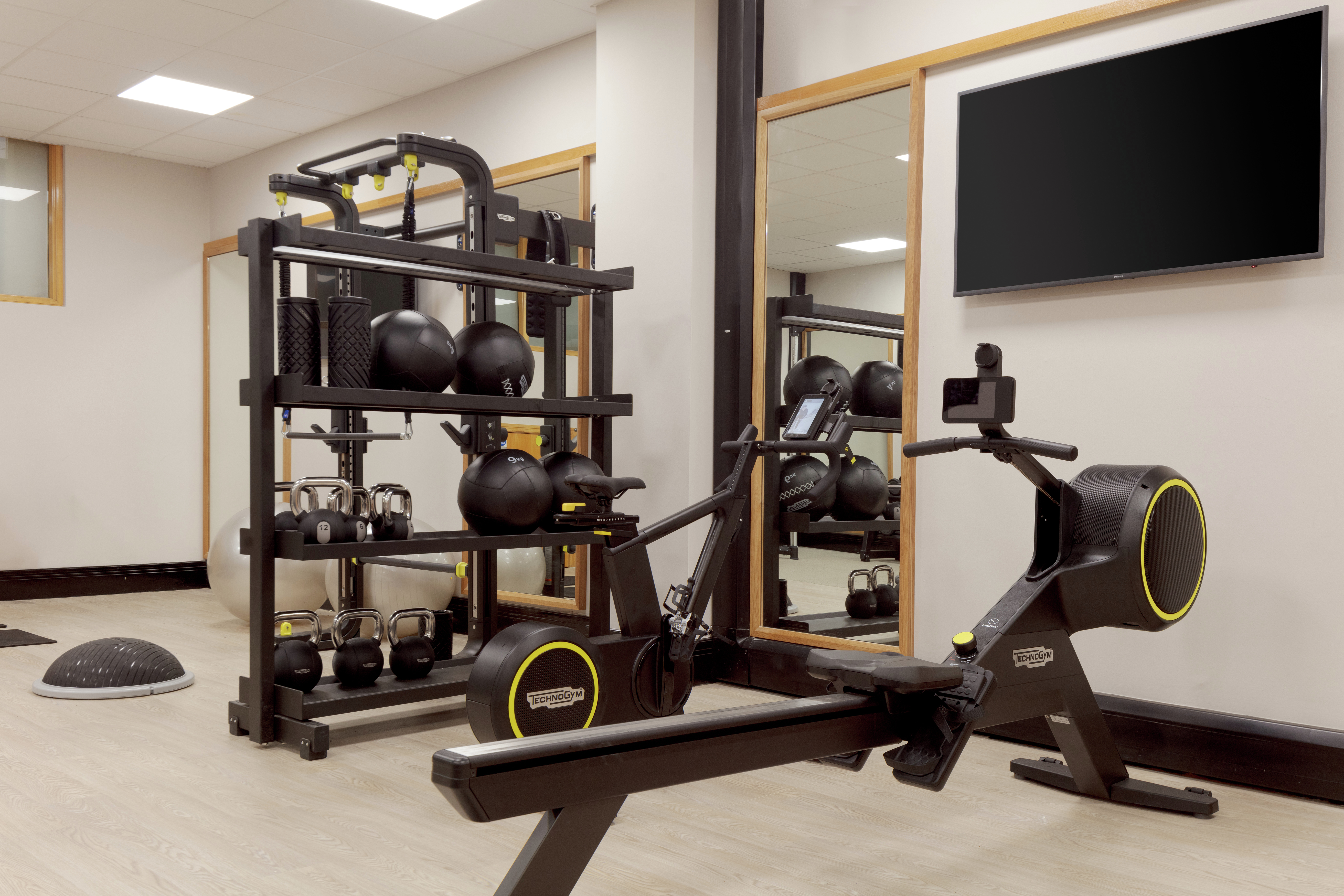 Fitness Room with Modern Equipment and HDTV
