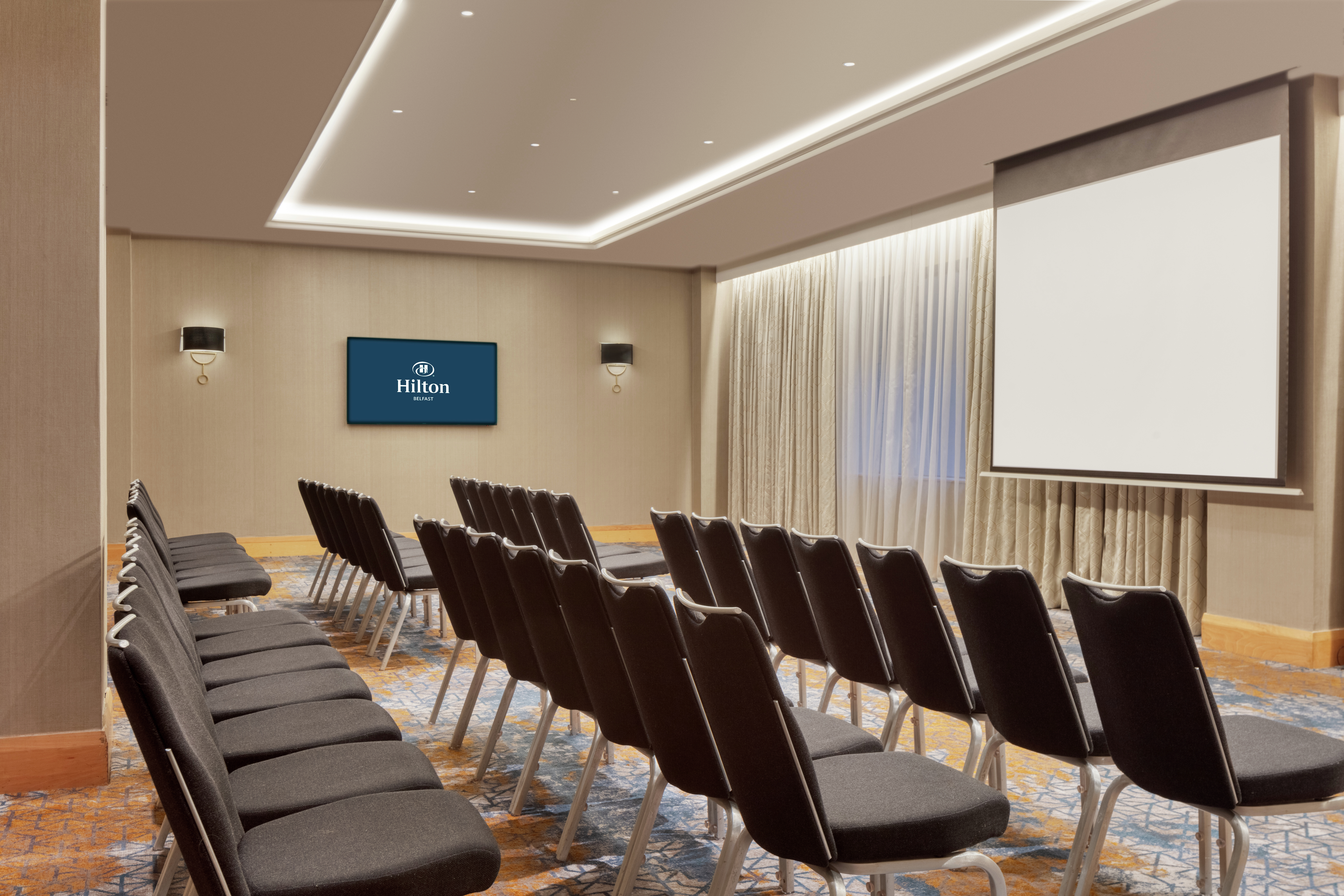 Theater Style Setup Meeting Room with Projection Screen and HDTV