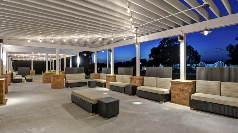 Outdoor patio at night with seating
