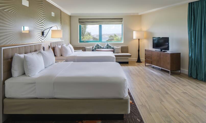 Premium Executive Corner Guestroom with Two Beds, Lounge Area, Outside View, and Room Technology