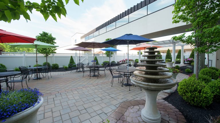 Tables With Sun Umbrellas on Carbo Garden Terrace