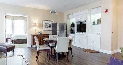 Two King Two Bedroom Suite with Bed, Dining Area, Kitchenette, and Room Technology