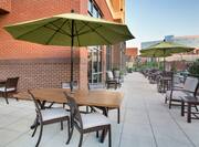 Outdoor Patio Area with Chairs and Tables with Umbrellas
