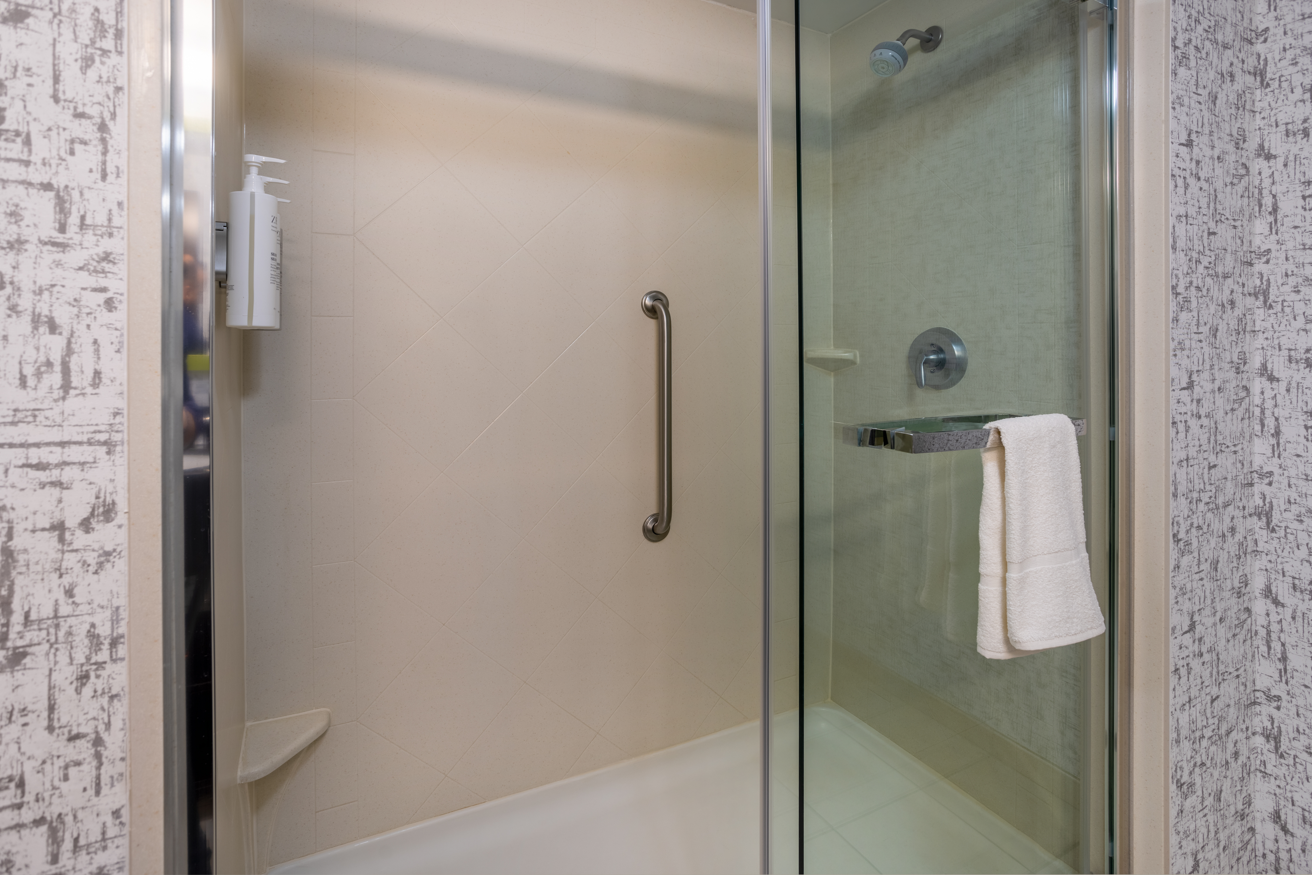 Large, glass walled showers