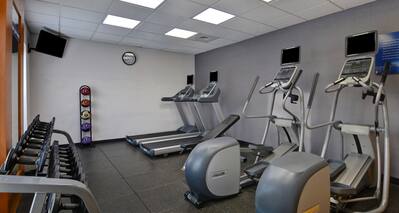 Fitness Center with Treadmills Weights and Recumbent Bikes