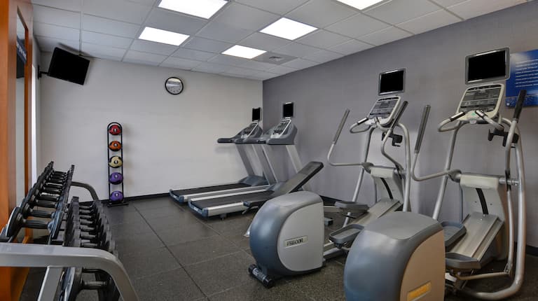 Fitness Center with Treadmills Weights and Recumbent Bikes