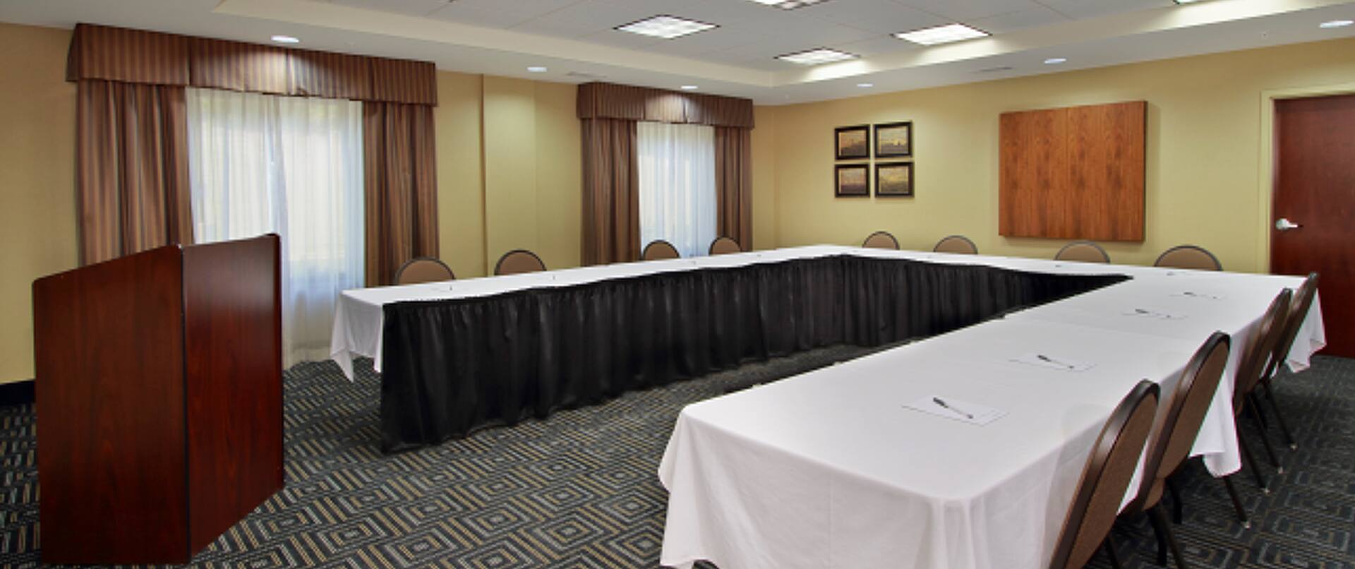 Meeting Room With Seating for 12 at U-Shaped Table and Podium