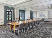 Limes Suite Boardroom with Table, Chairs, and Projector Screen