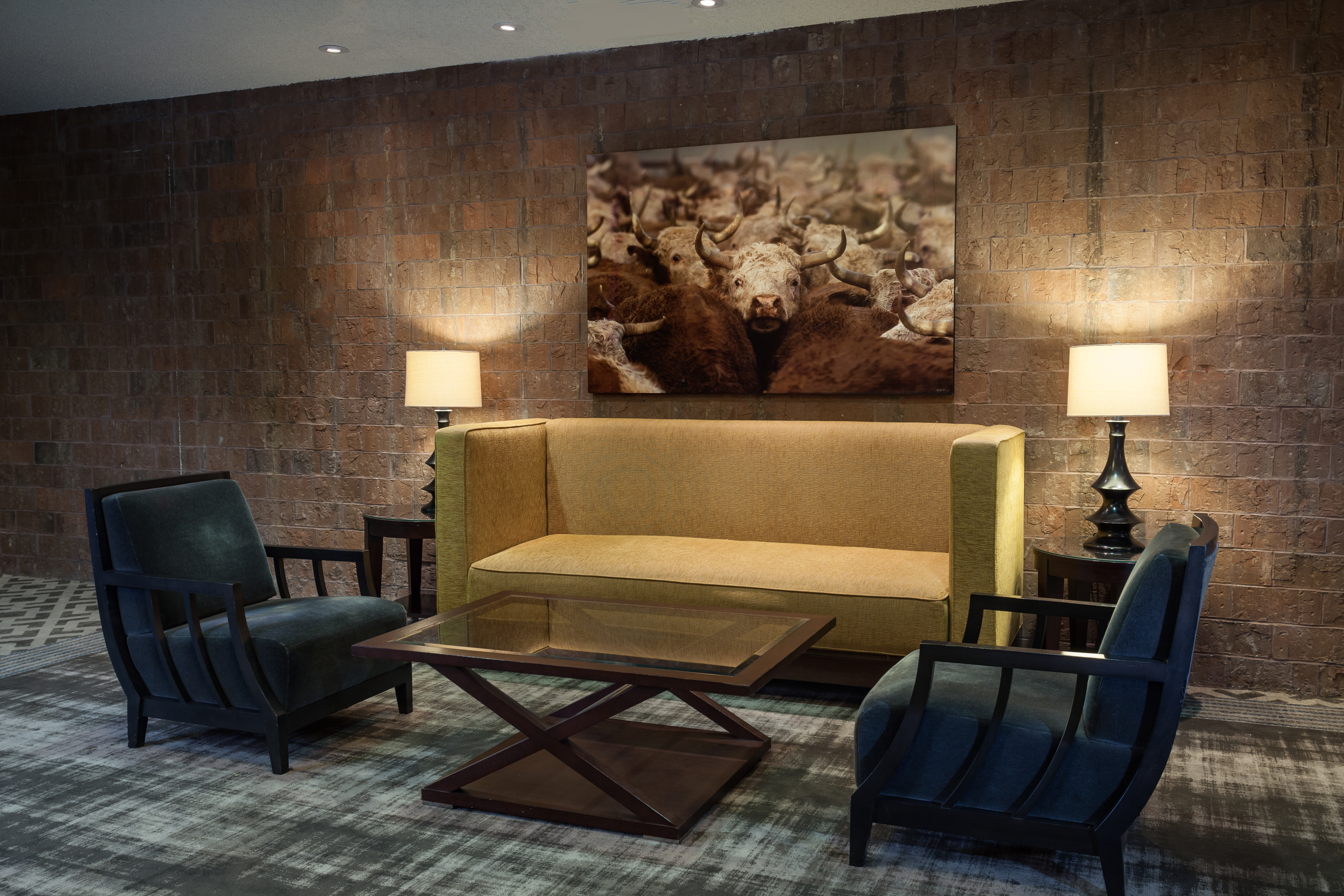 Wall Art, Illuminated Lamps, Coffee Table and Conversational Seating in Lobby