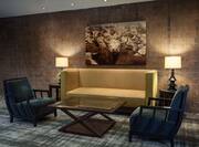 Wall Art, Illuminated Lamps, Coffee Table and Conversational Seating in Lobby