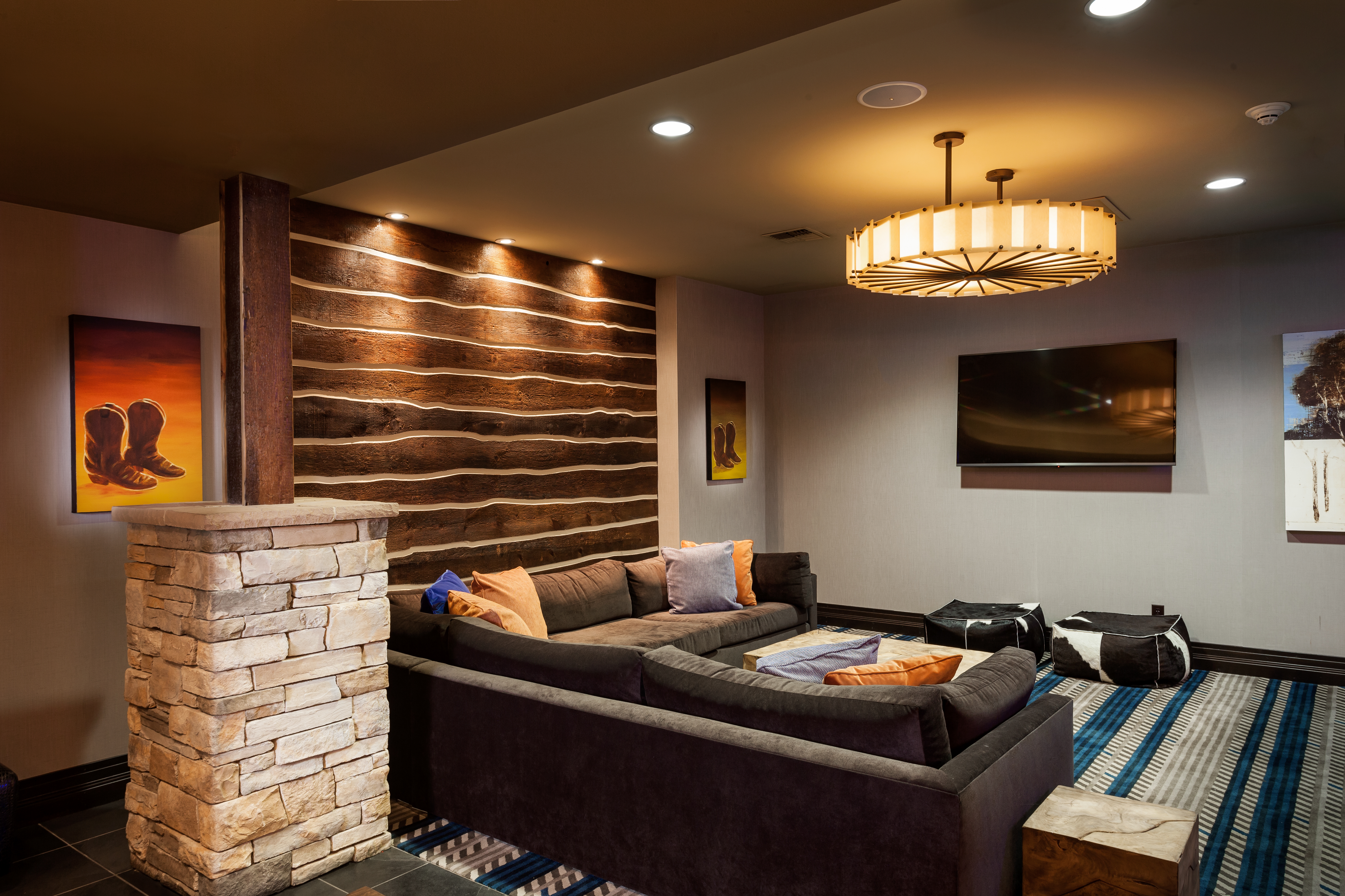 Wall Art, Casual Sectional Sofa and TV in Bar Lounge Area