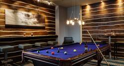 Montana's Lounge With Wall Art Above Counter Seating, Bar Table, Chairs and Pool Table