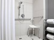 ADA Guest Bath With Roll-In Shower, Shower Seat, Grab Bars, Handheld Showerhead and Fresh Towels