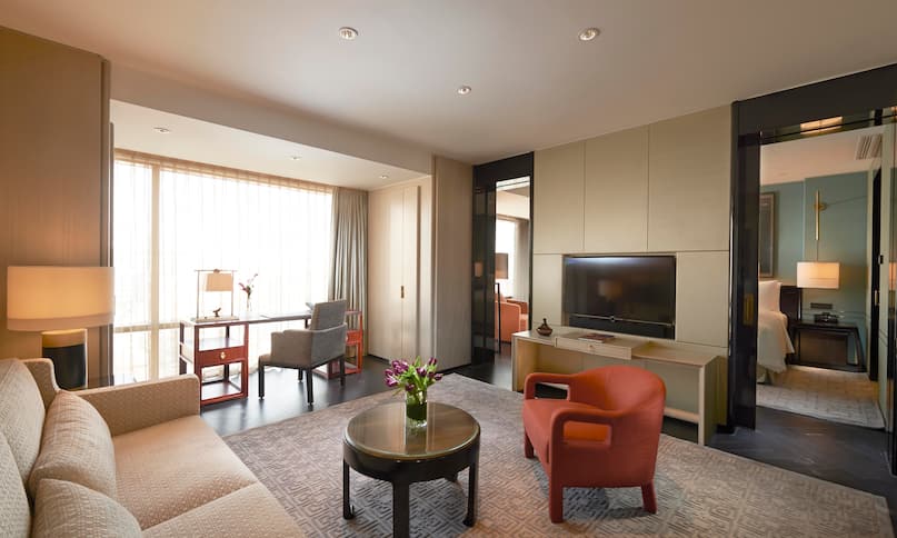Deluxe Suite - Sofa, Desk and Guest Room-next-transition