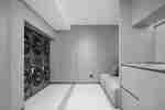 Guest Laundry Area With Lounge Seat and Laundry Cabinet System