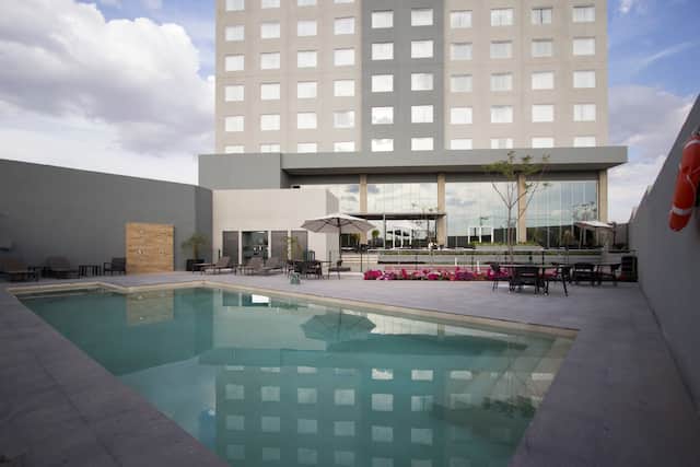 Outdoor Swimming Pool and Patio Area at Daytime