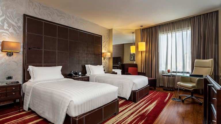 Two Beds in a Guest Room with Desk Area