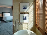 bathtub and view of bedroom
