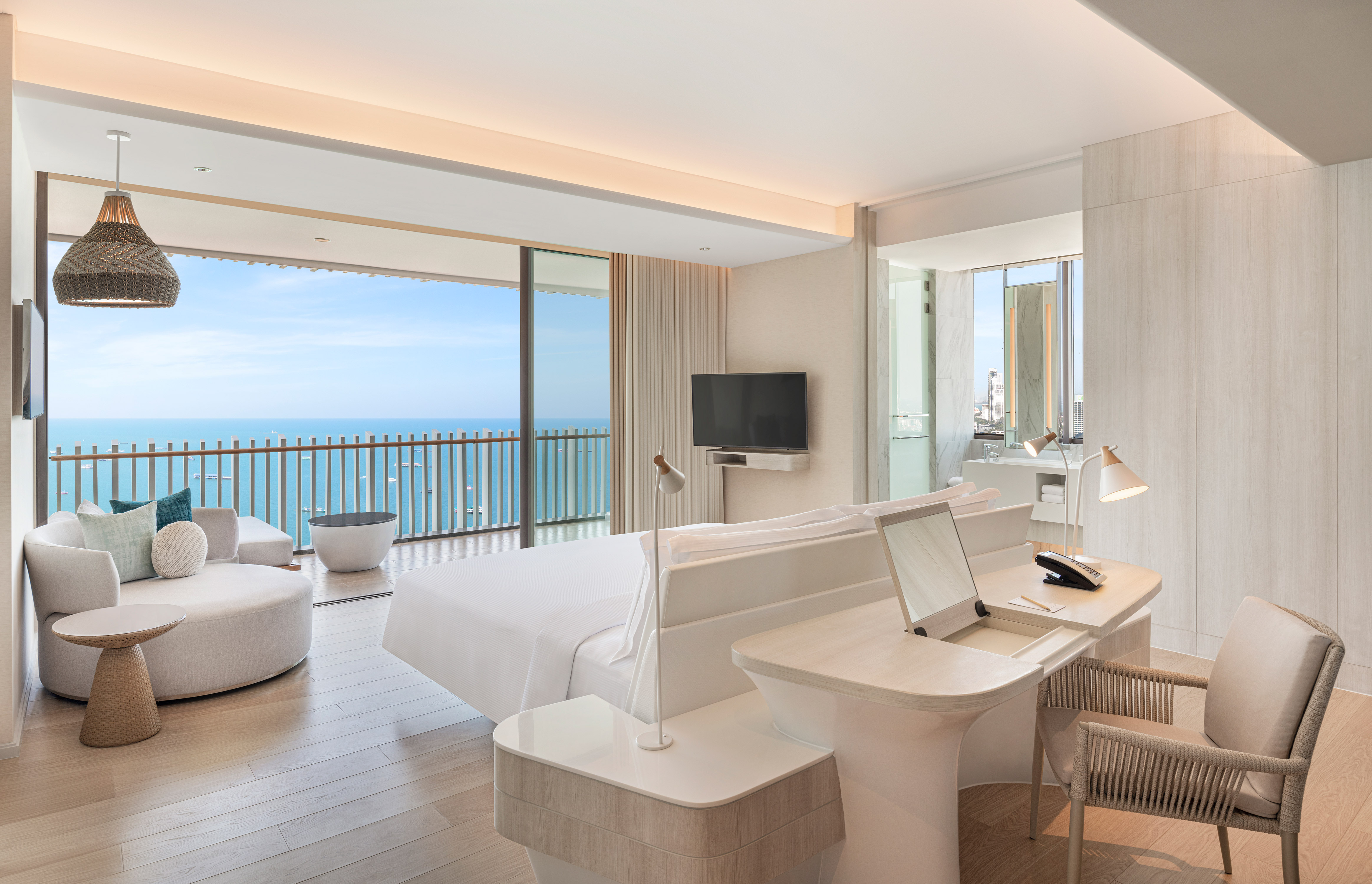 Large Bed Desk and HDTV in Suite with Ocean View