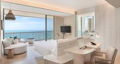 Large Bed Desk and HDTV in Suite with Ocean View