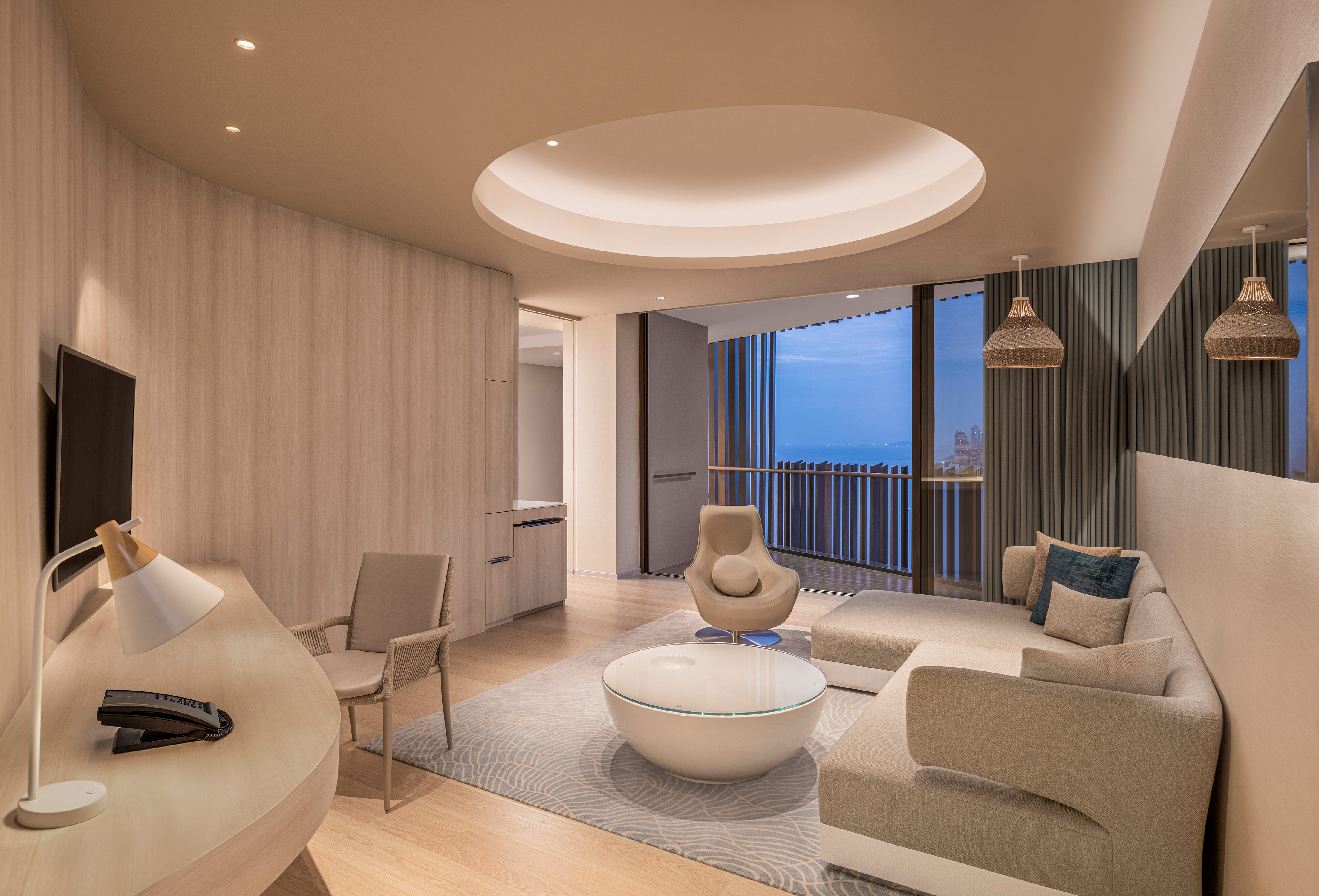 Premium Ocean Suite Living Area with HDTV and Desk