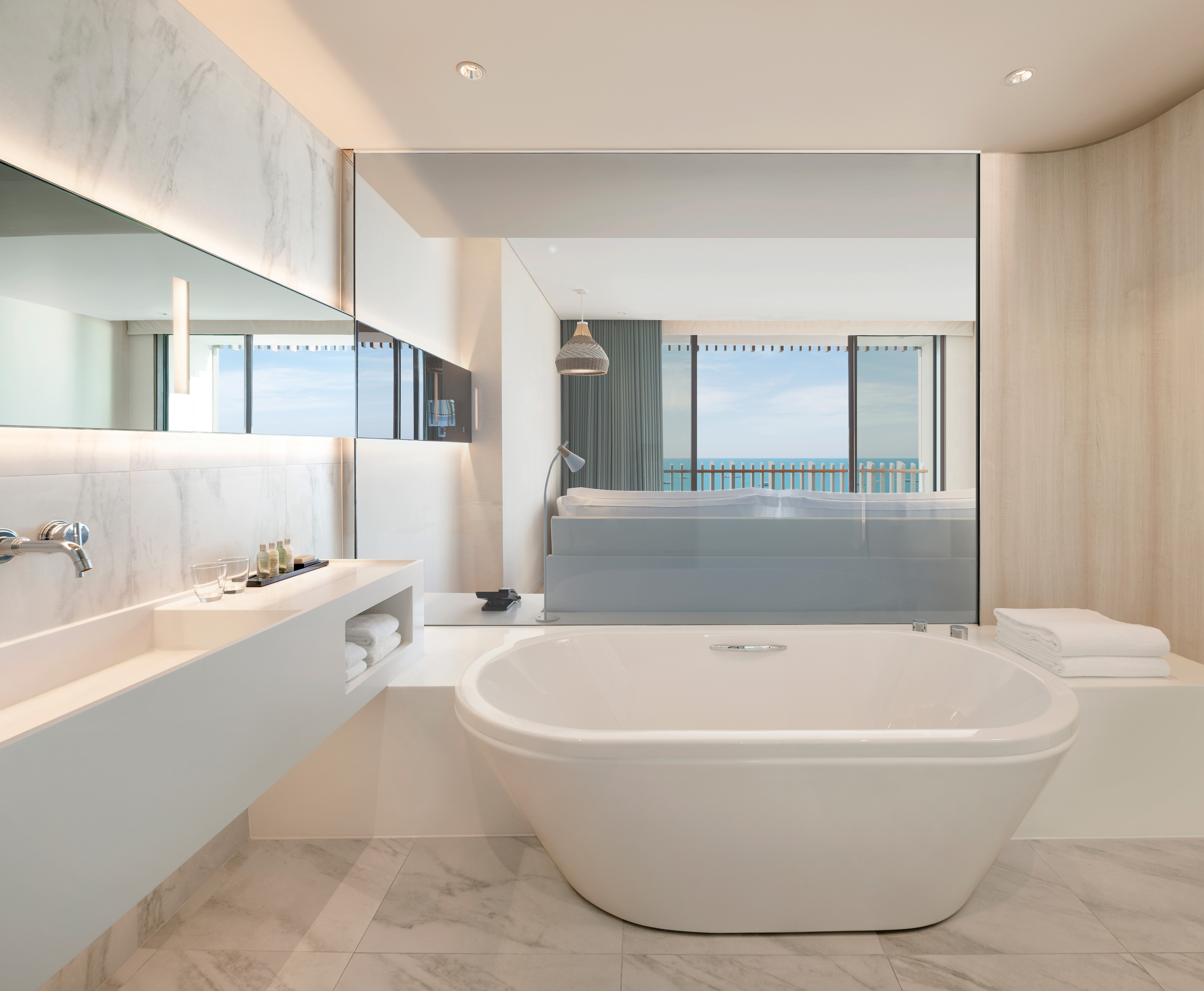 Vanity Area and Bathtub of Guest Room with Ocean View