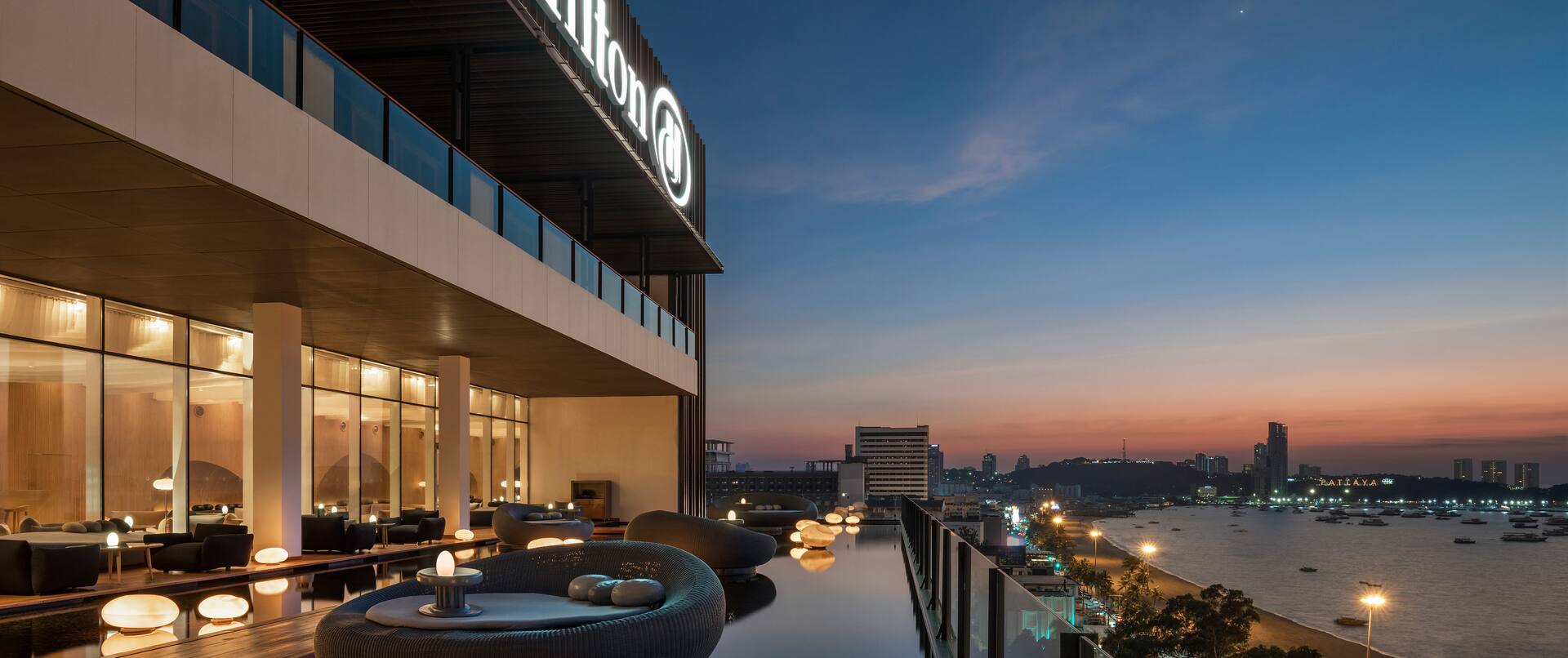 Terrace of Drift Lobby Lounge and Bar with View of the Bay at Sunset