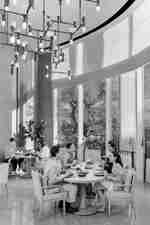 Group of people sitting in restaurant area with food