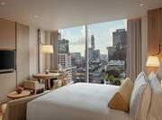 King Bed, Flat Screen TV, and City View in Deluxe Guest Room
