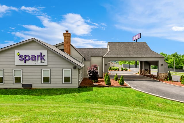 daytime exterior showing front of building with sign