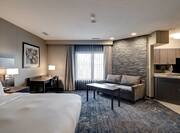 Presidential Suite with Bed, Lounge Area, Work Desk, and Kitchen