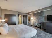 Presidential Suite Bedroom with Bed and Room Technology