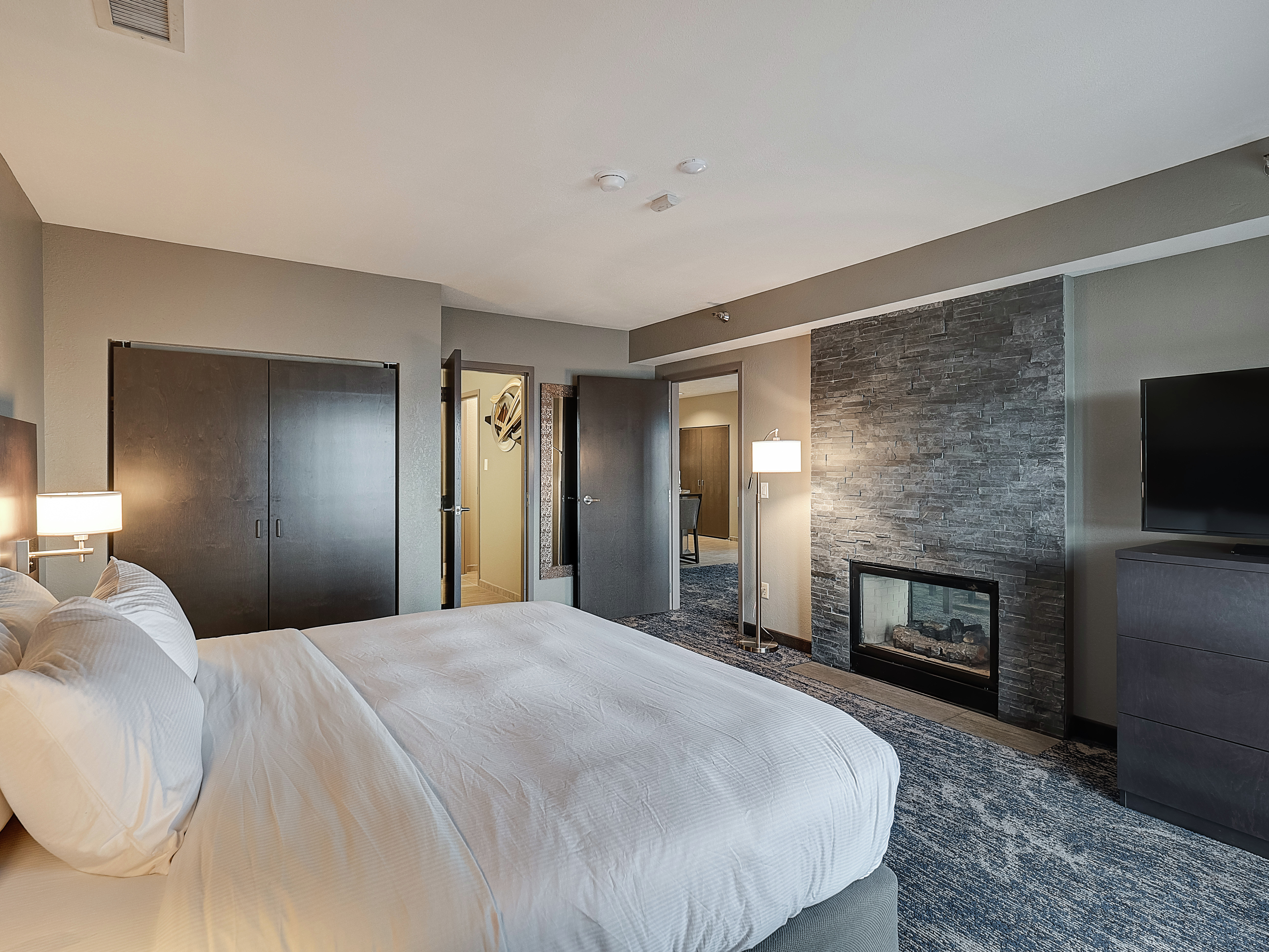 Presidential Suite Bedroom with Bed and Room Technology