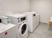 Guest Laundry Room with Coin-Operated Washing Equipment