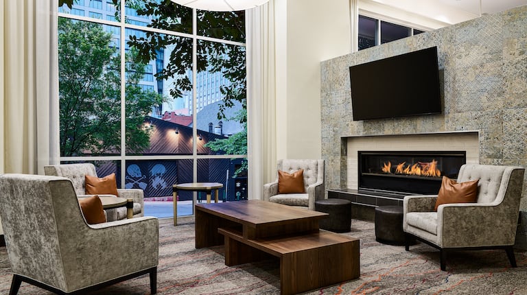 Lobby Sitting Area with HDTV, Fireplace and Large Windows