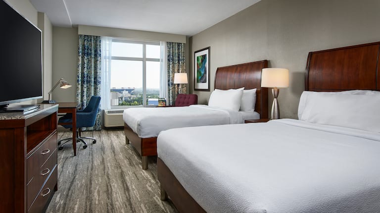 Guest room with Two Beds, HDTV, Work Desk and View of Nashville Landmarks