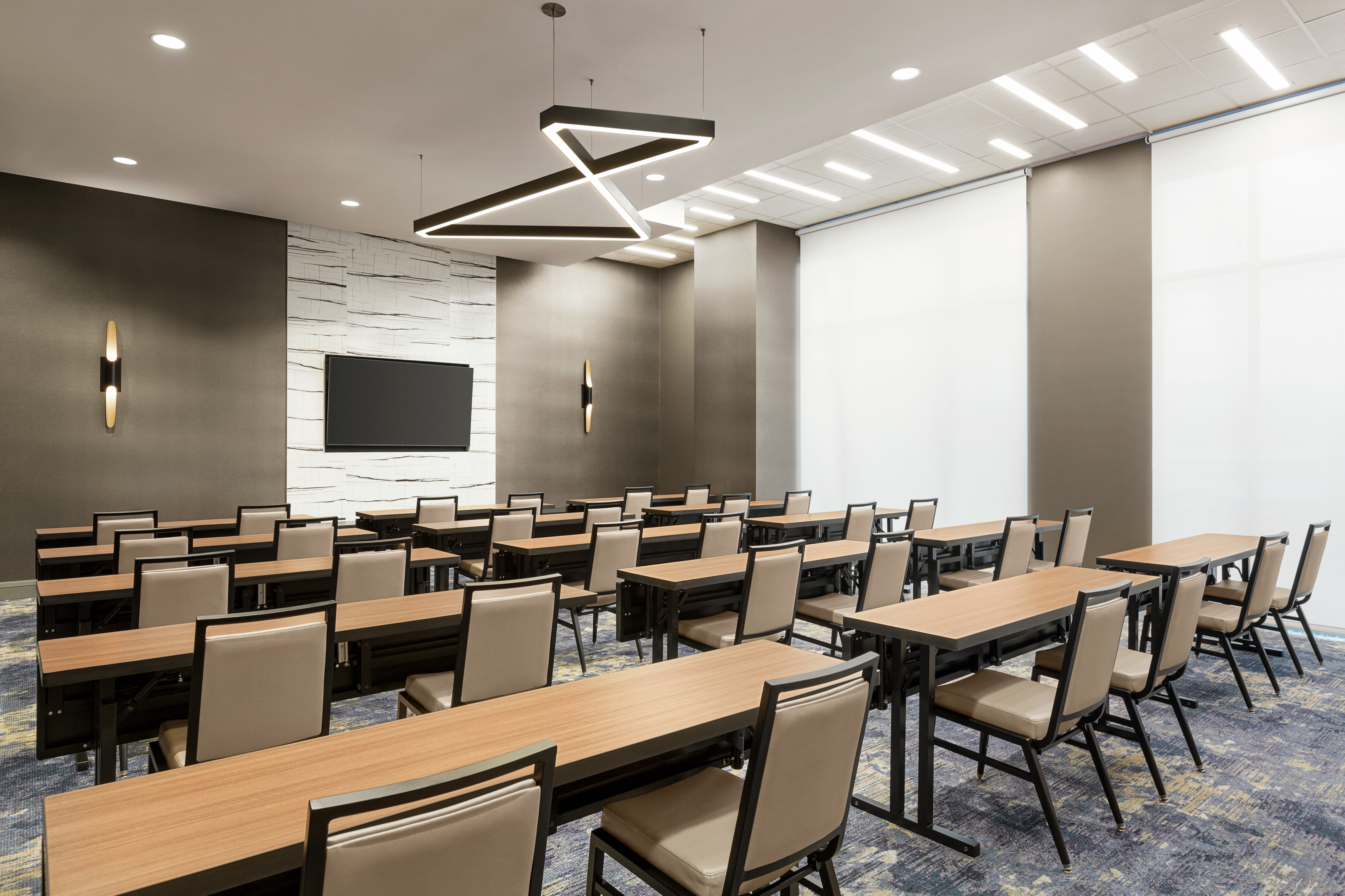  Spacious meeting room featuring classroom style table setup.