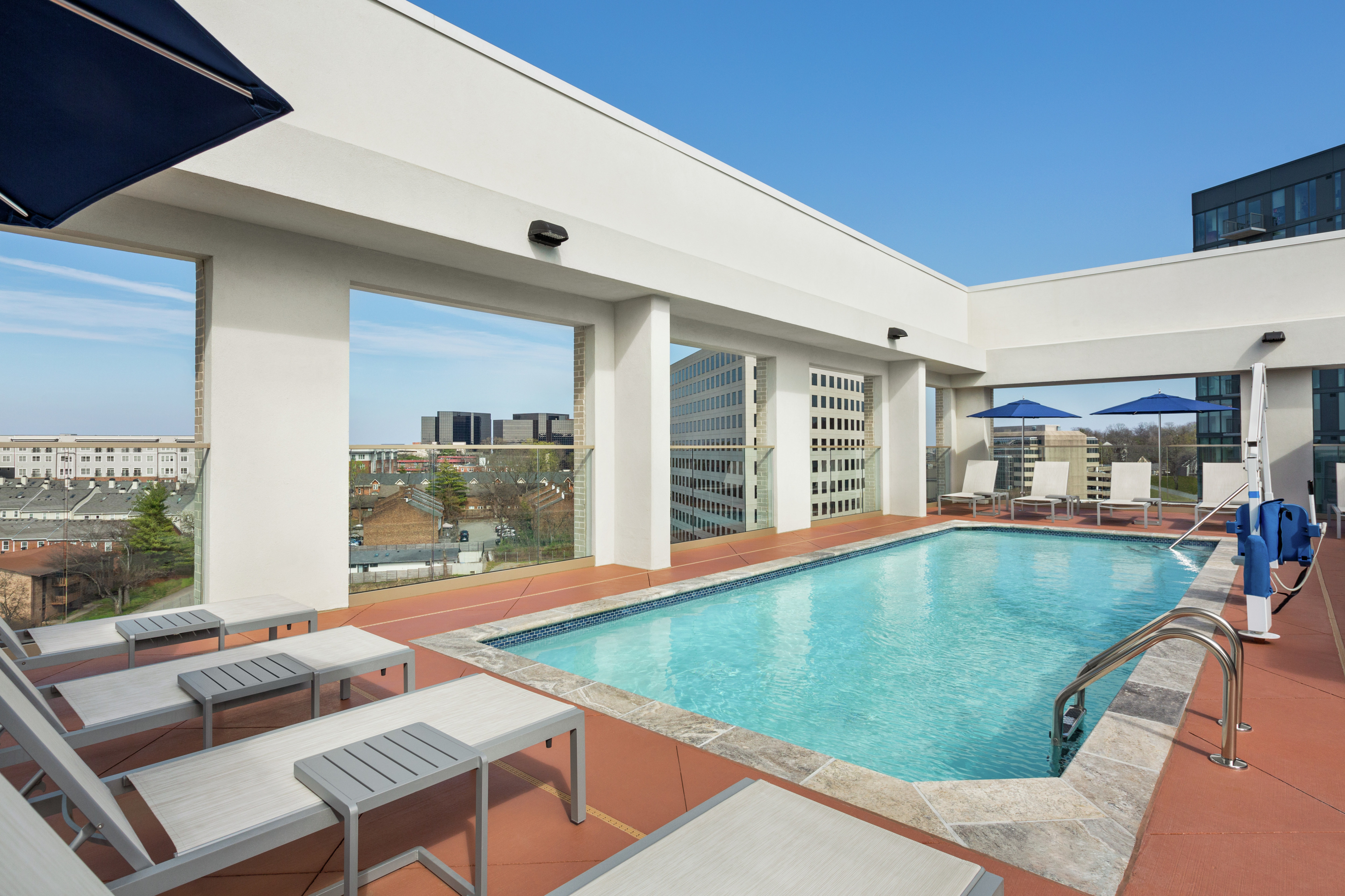 Beautiful outdoor rooftop pool with ample seating and ADA Chair Lift.